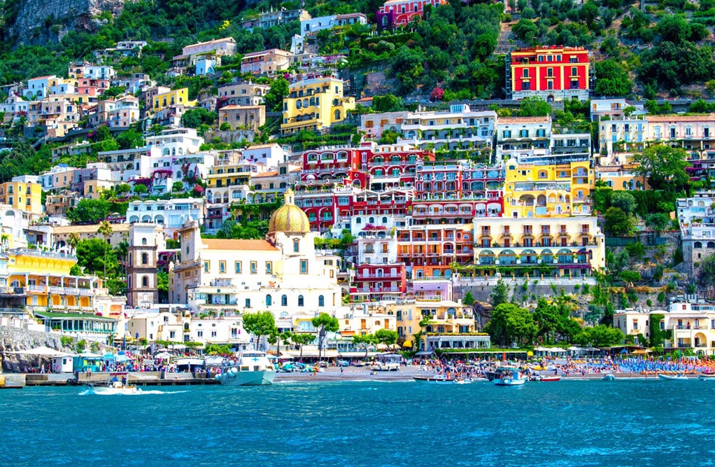 Scenic Positano, with vibrant buildings cascading down the cliffs, epitomizing the beauty of Italy's Amalfi Coast.